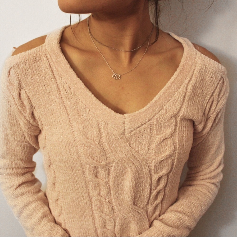 Light pink fuzzy sweater. Cold shoulder